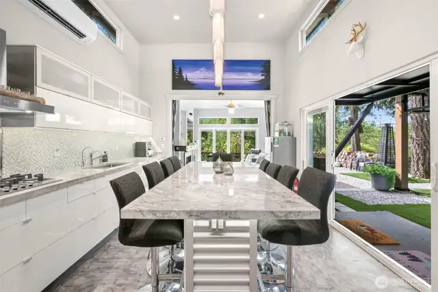 The 8' x 42" granite island with 10 bar stools.