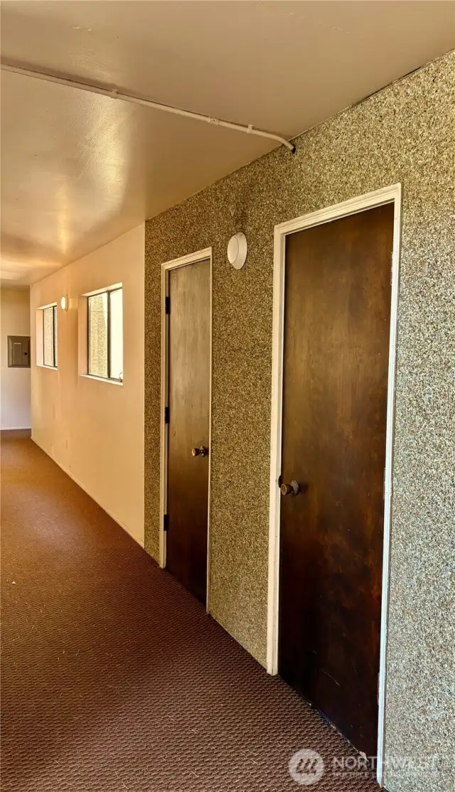 This hallway inside the building gate is the access to storage closet #1, for Unit 205.