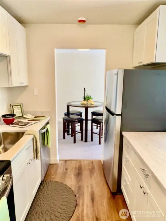 Wonderful new kitchen. All new cabinets, quartz counters, stainless appliances and bright new fixtures. New laminate wood flooring, too.