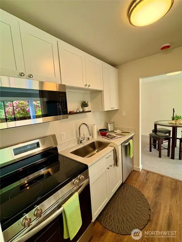Shaker style cabinets, and stainless steel appliances.