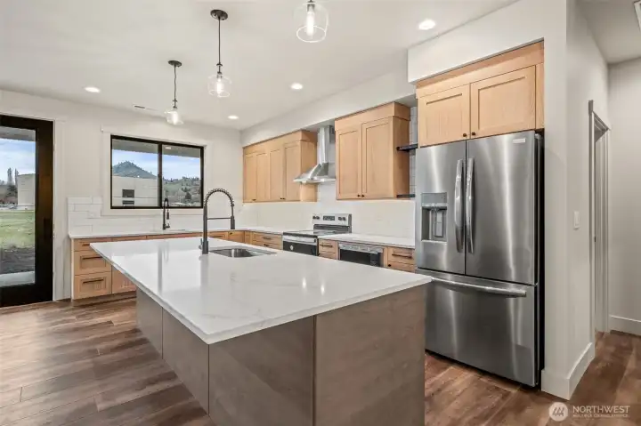 Large kitchen with new appliances and two sinks