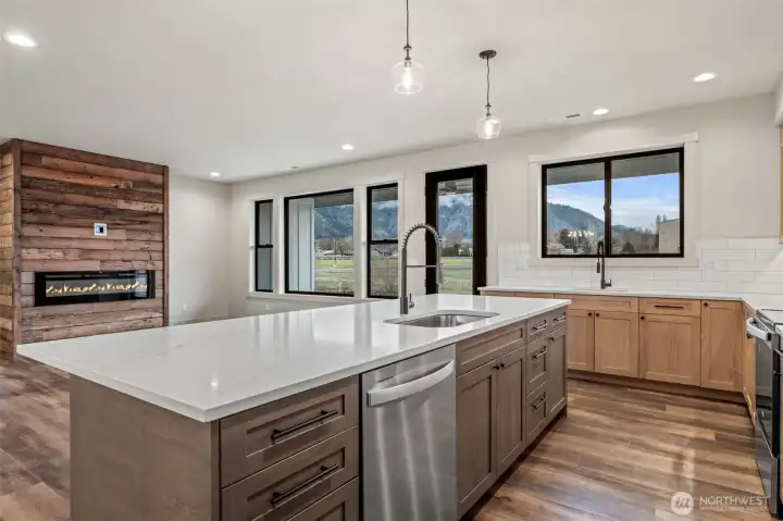 Dishwasher under island with sink for convenience