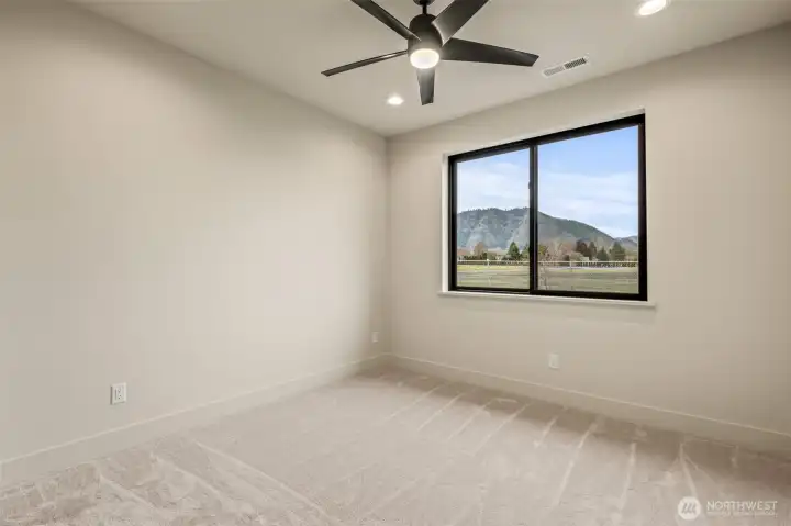 Second bedroom with spacious layout and mountain view