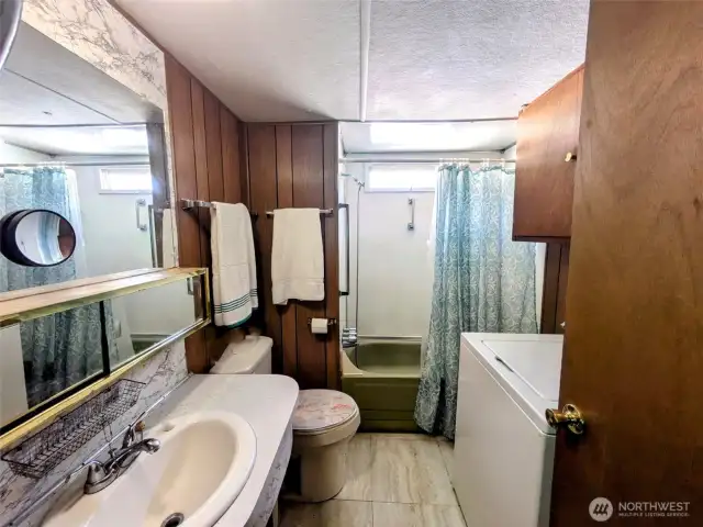 Full bathroom and washer. Dryer is on covered porch.