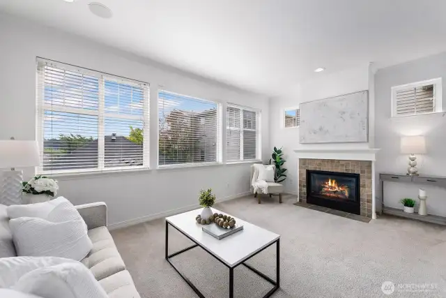 Beautiful, light filled sunken living room, with cozy gas fireplace.