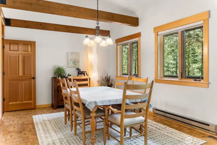 Spacious Dining room is full of natural light with an area that may accommodate a larger dining table and serve a crowd if desired.