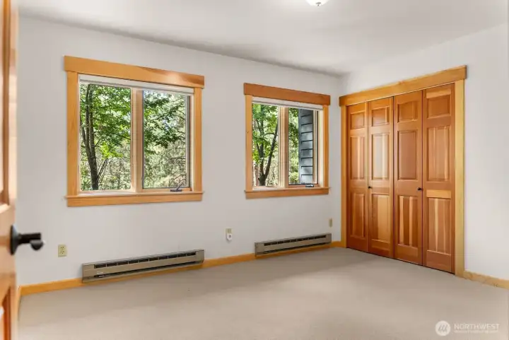 Bedroom 3, heated, closets, wool carpet and natural light for a fresh living area on daylight basement.