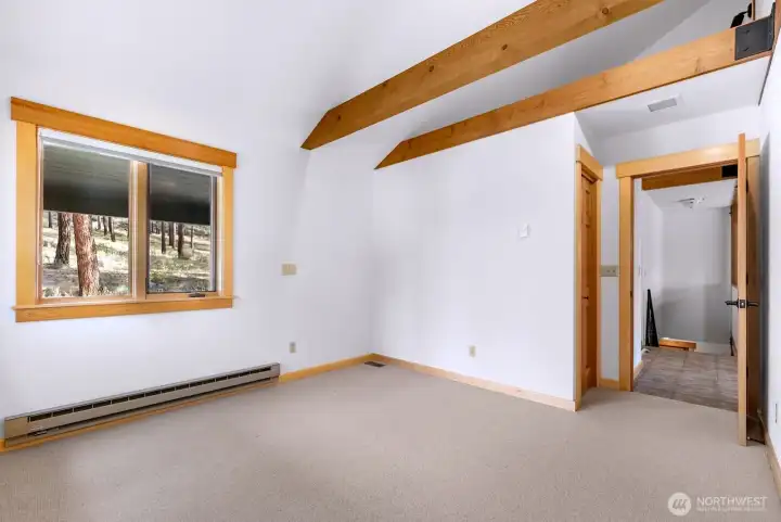 Bedroom 1, main level of home is carpeted, has closet. Baseboard heat.