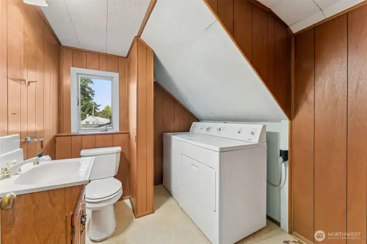 Half bath with laundry on the upper level.
