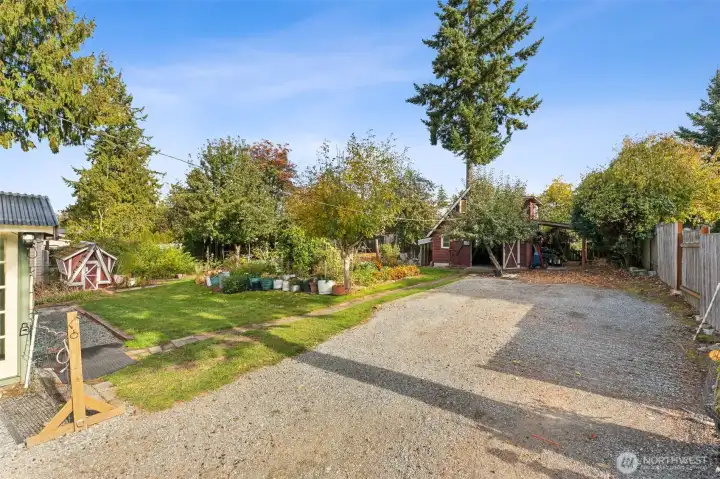 Long driveway leads to the Barn/Detached garage & carport.