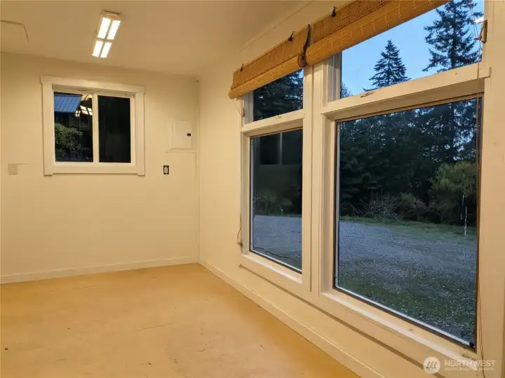 The studio/office attached to the carport has huge windows.