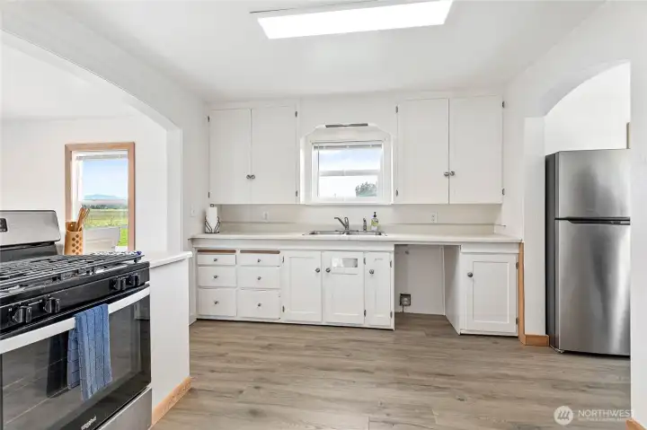 Kitchen with stainless steel gas cooktop