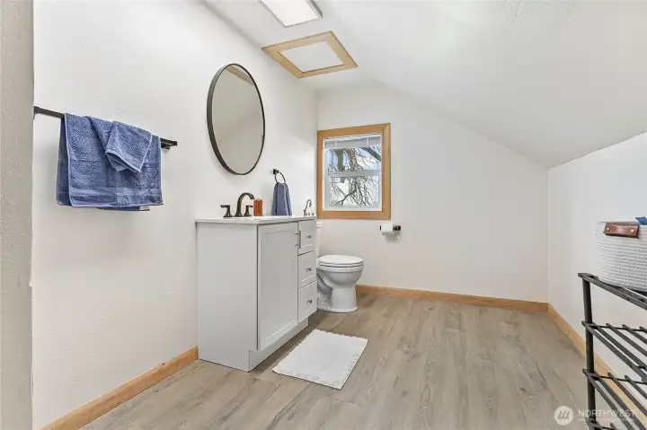 Upstairs bathroom, new toilet, cabinet, sink and mirror