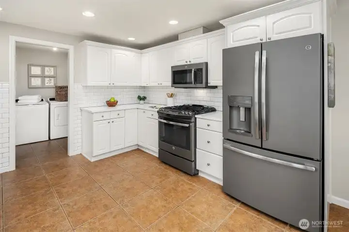 A Chef's Dream with Gas Range & Stainless Steel Appliances