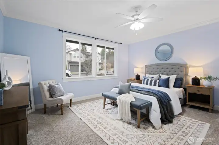 Rare main-floor primary suite complete with bathroom heated floors and spacious walk-in closet.