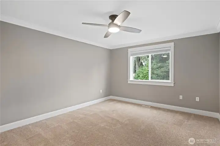 Here is the second bedroom on the upper level.  Ceiling fan with light and views to the back yard.