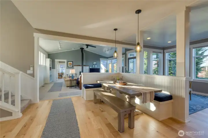 Walking in to the kitchen with breakfast nook and formal dining.  Beautiful gleaming hardwood floors.