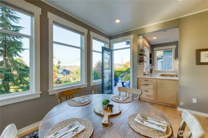 Dining area has french door to entry deck and pass through from the cooking area.