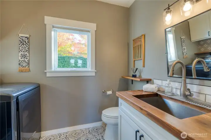 Laundry with 1/2 bath off kitchen.