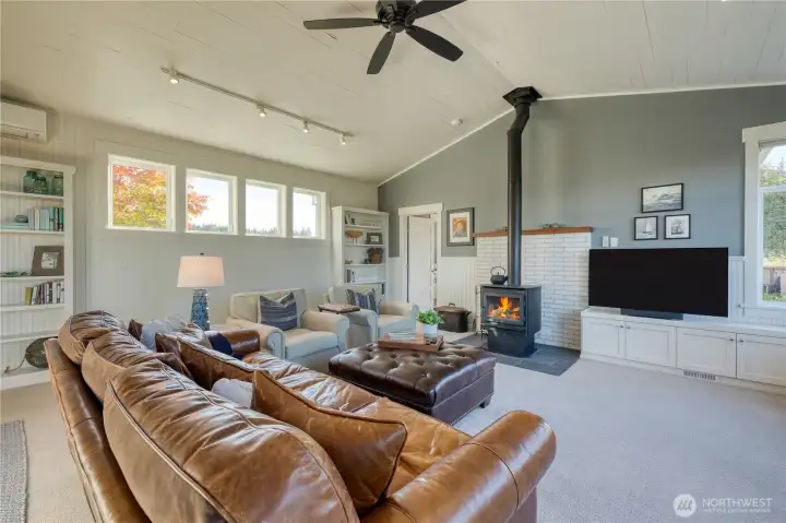 The living room is spacious!  Fireplace is wood burning and vaulted ceilings make for a great room.