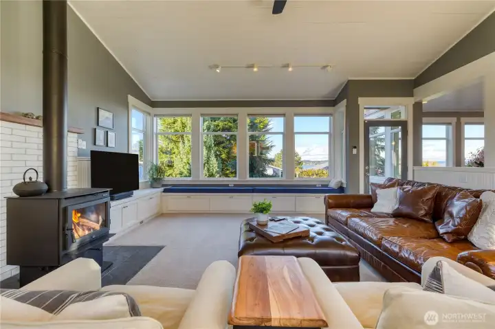 Bench seating and another french door that leads to the outdoor living and detached parking.