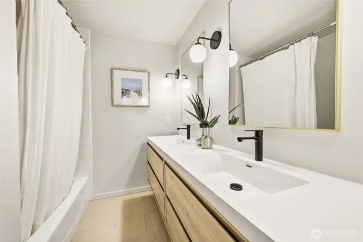 Remodeled full bathroom off the primary bedroom.