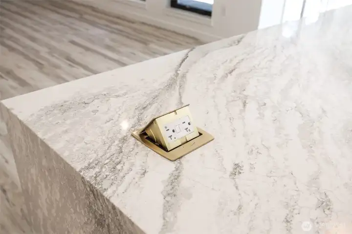 Pop up outlets on island