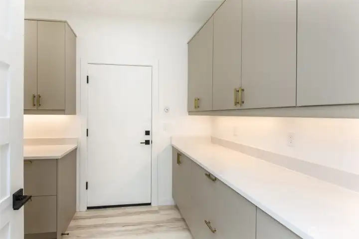 Laundry room has plenty of storage