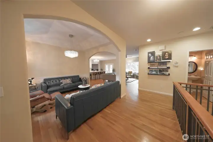 Just inside the entry, a flexible dining space offers a warm first impression, currently arranged as a cozy lounge area. Just inside the entry, a flexible dining space offers a warm first impression, currently arranged as a cozy lounge area.