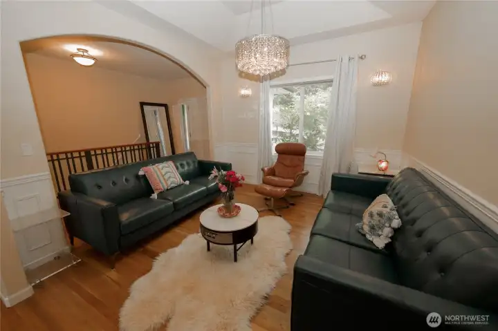 This versatile room works beautifully as a dining room or sitting area, with a statement chandelier adding a touch of elegance. This versatile room works beautifully as a dining room or sitting area, with a statement chandelier adding a touch of elegance.