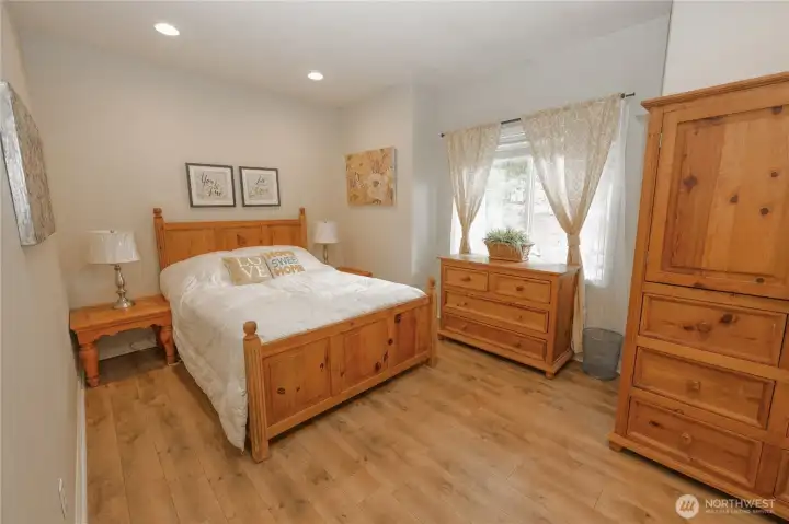 A second bedroom on the main level offers a peaceful view of the mature front landscaping. A second bedroom on the main level offers a peaceful view of the mature front landscaping.