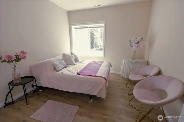 One of two additional bedrooms on the daylight lower level, offering flexible space for guests, family, or a home office. One of two additional bedrooms on the daylight lower level, offering flexible space for guests, family, or a home office.