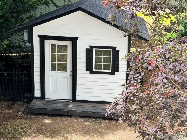 A charming storage shed, freshly painted with a new roof, offers extra space for lake toys, tools, or garden supplies. A charming storage shed, freshly painted with a new roof, offers extra space for lake toys, tools, or garden supplies.