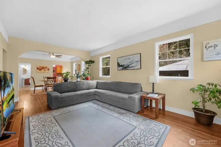 Living room opens into dining room. Lots of windows make this room light and bright.