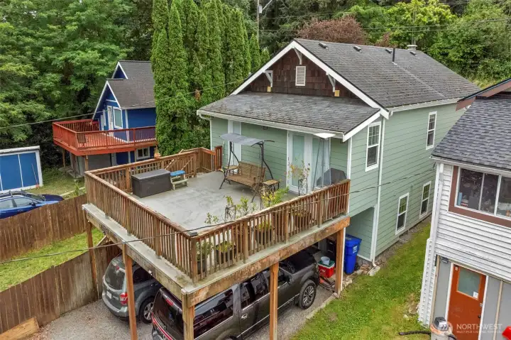 View of deck and carport with storage.
