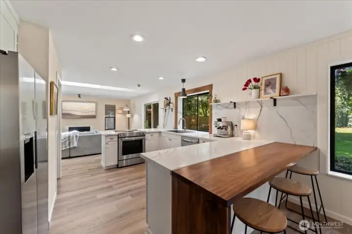 You have two options for dining, casual at the counter and behind this area you have ample room for a large dining table. You have two options for dining, casual at the counter and behind this area you have ample room for a large dining table.
