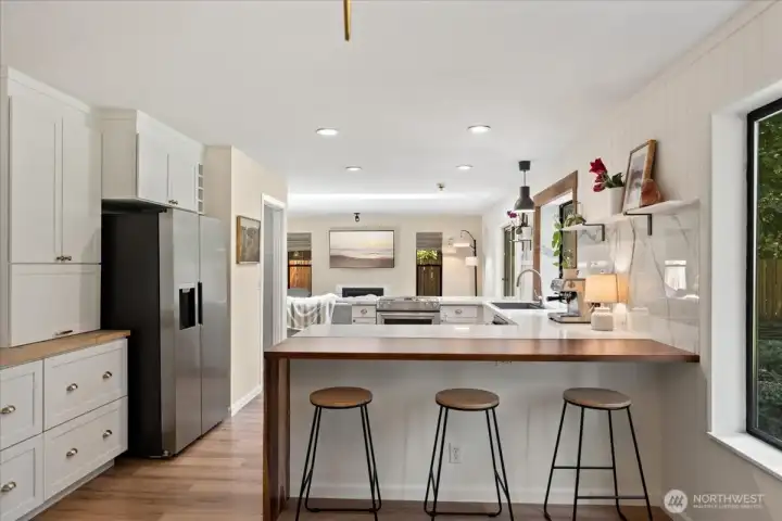 A bright open kitchen with modern finishes and abundant storage. A bright open kitchen with modern finishes and abundant storage.
