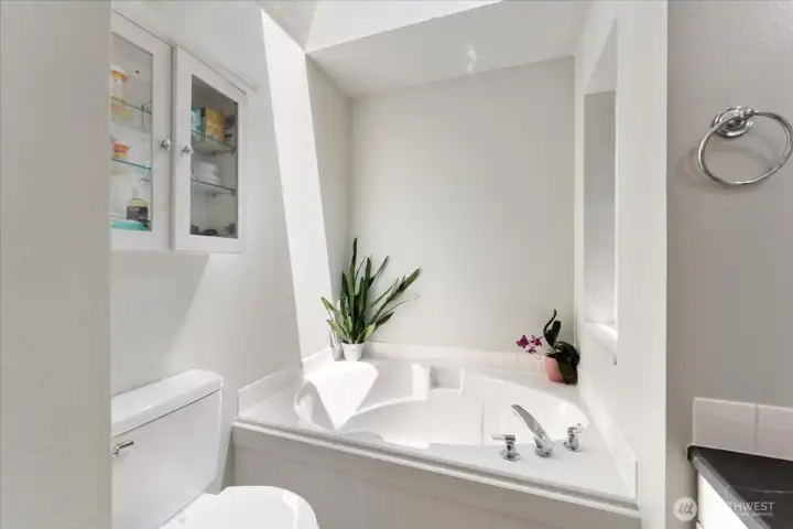 Unwind in the soaking tub, the perfect place to recharge after a long day. Unwind in the soaking tub, the perfect place to recharge after a long day.