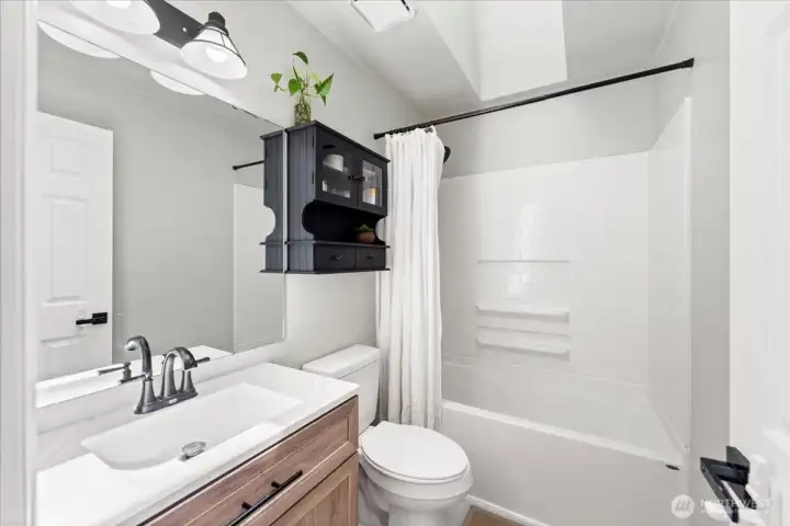 Renovated full bath includes new vanity, lighting, mirror, brushed stainless fixtures, tub/shower enclosure, flooring and toilet. All the work has been done for you to enjoy. Renovated full bath includes new vanity, lighting, mirror, brushed stainless fixtures, tub/shower enclosure, flooring and toilet. All the work has been done for you to enjoy.