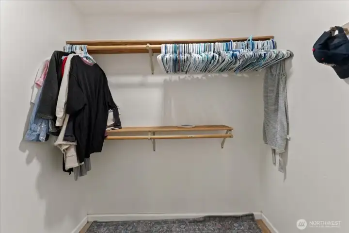 Functional laundry room with a storage cabinet and a dedicated hanging area to make laundry easier. Functional laundry room with a storage cabinet and a dedicated hanging area to make laundry easier.