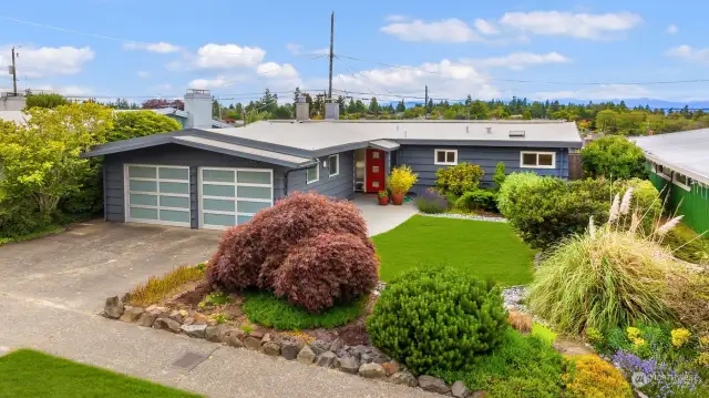 Mid-Century Olympic Manor home with protected Puget Sound and Olympic Mountain views.
