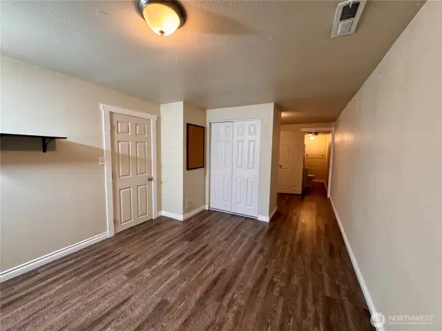 The closet for this bonus room. You walk around the corner and there is another space to use as an office or dress it out as a walk in closet. En suite bath is beyond.