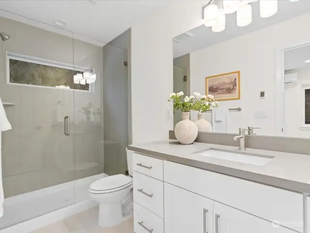 Custom tile and radiant floor heating in both upstairs bathrooms.