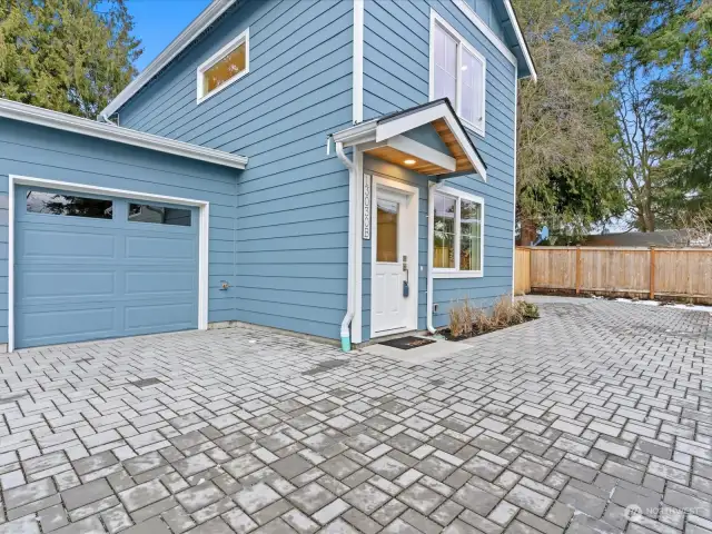 Come see this new construction home with a private garage and two off-street parking spots.