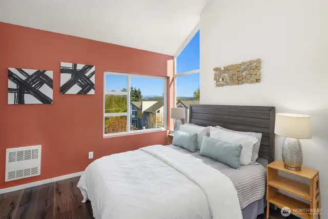 The primary bedroom suite is out of the sight line of any neighbors’ windows so you get to enjoy privacy. Primary bedroom suite features a new ceiling fan, vaulted ceilings, and CASCADE MT views.