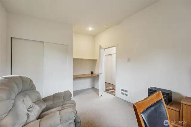 The second bedroom on the main floor is being used as an office by the sellers.