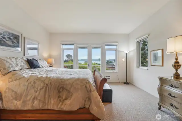 The spacious primary bathroom is complete with views, deck access, ensuite and walk-in closet.