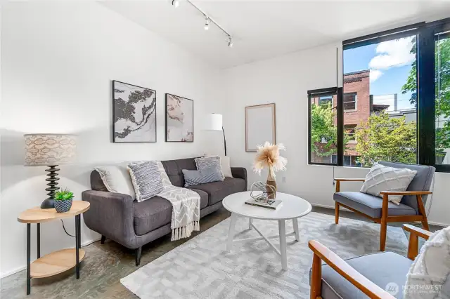 Spacious, bright and airy, this modern Capitol Hill condo provides an in-city retreat with large windows and aesthetically pleasing concrete floor.