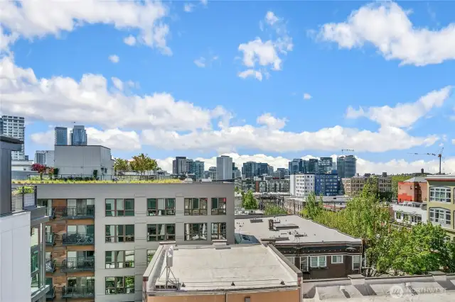 The well-appointed rooftop deck includes a seating area with fire feature, dining table, BBQ and views!