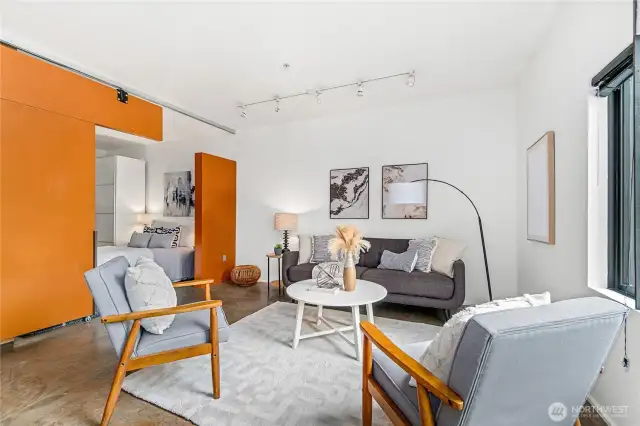 The open layout plan with a movable jigsaw puzzle wall is perfect for living and entertaining.